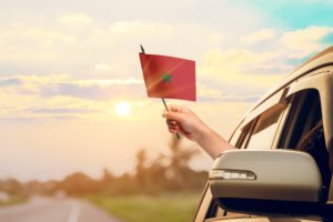 Waving,The,Morocco,Flag,Against,The,Sunrise,Or,Sunset,From